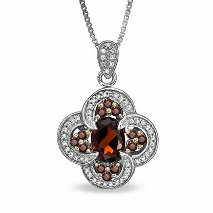 Oval Garnet and 0.33 CT. T.W. Enhanced Red and White Natural Diamond Pendant in Sterling Silver
