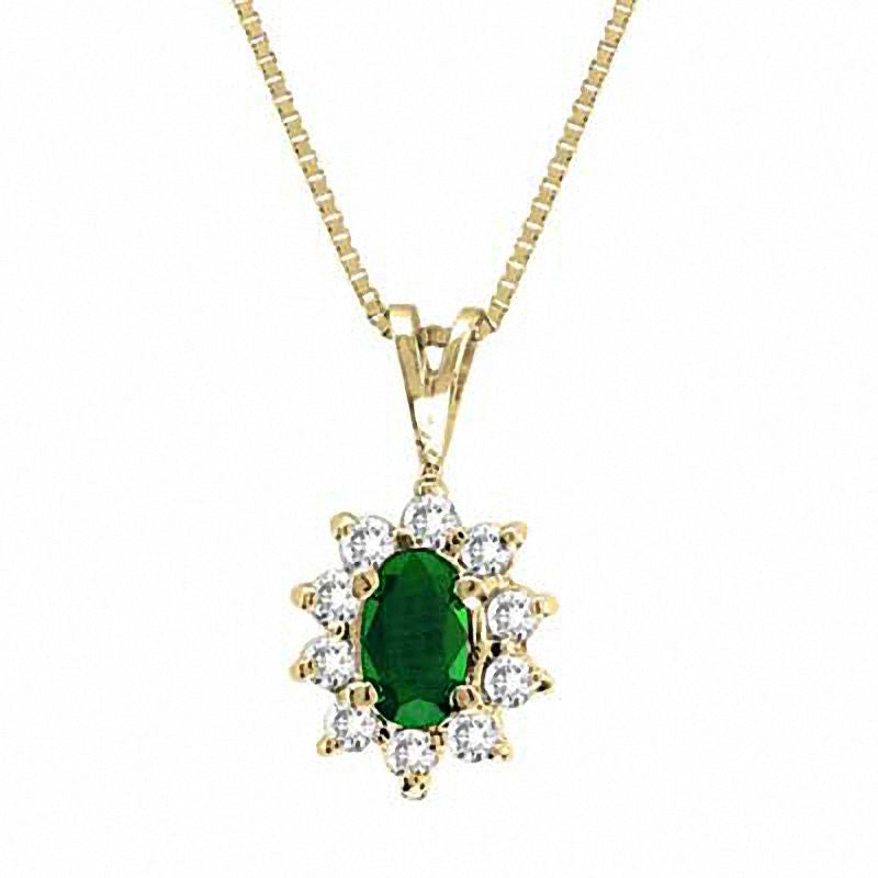 Oval Emerald and 0.13 CT. T.W. Natural Diamond Pendant in 14K Gold - 16"