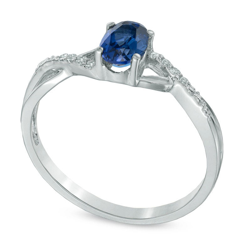 Oval Lab-Created Blue Sapphire and Diamond Accent Twist Engagement Ring in Solid 10K White Gold