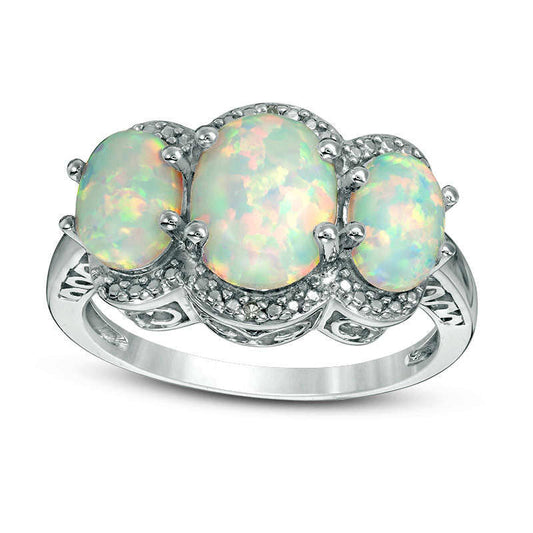 Oval Lab-Created Opal and Diamond Accent Three Stone Frame Ring in Sterling Silver