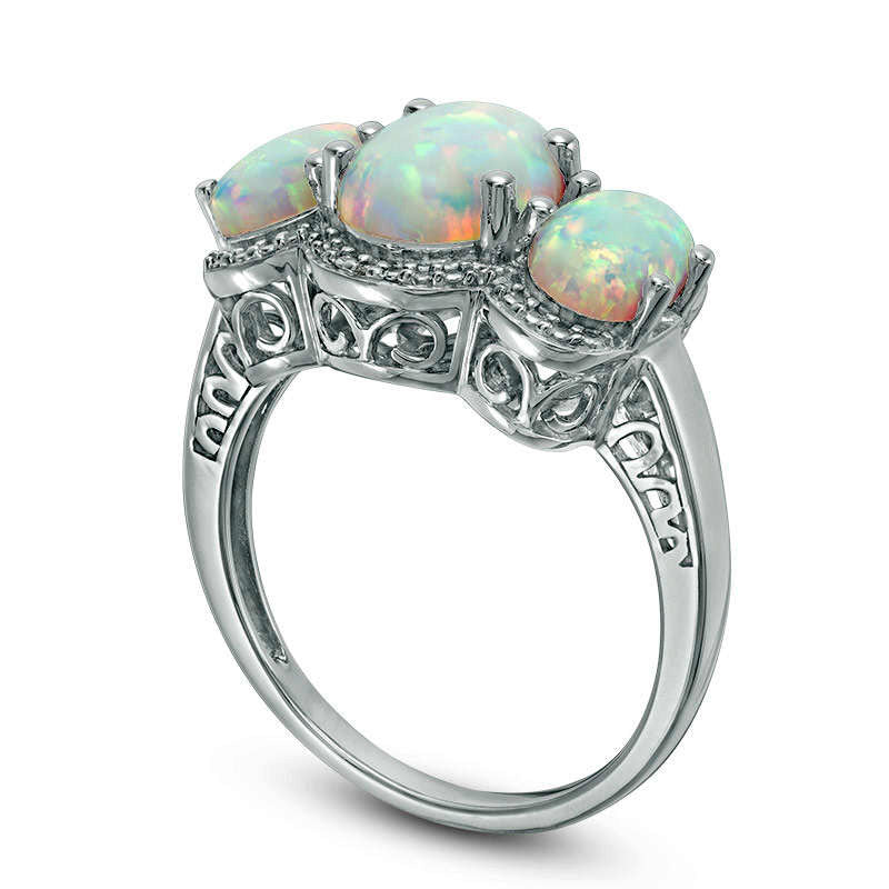 Oval Lab-Created Opal and Diamond Accent Three Stone Frame Ring in Sterling Silver