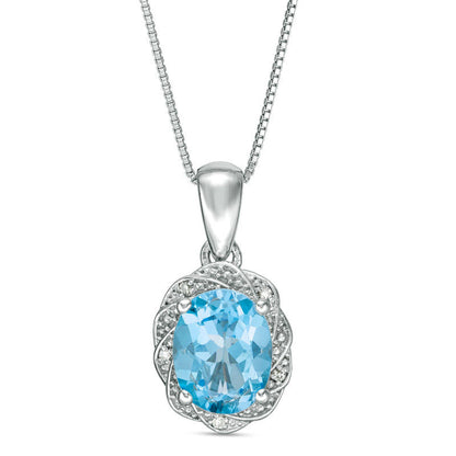 Oval Blue Topaz and Natural Diamond Accent Pinwheel Frame Pendant in Sterling Silver