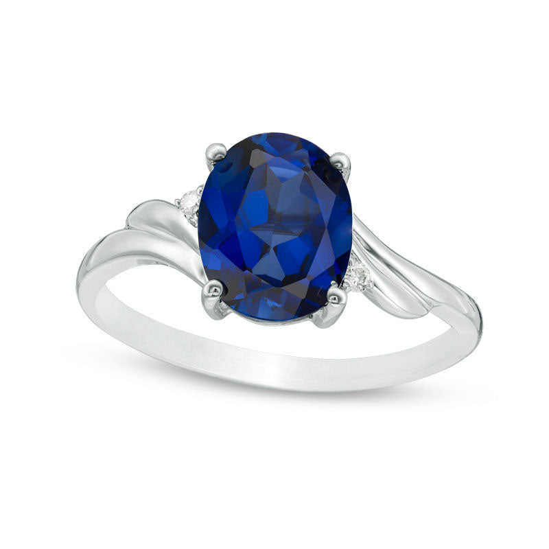 Oval Lab-Created Blue Sapphire and Diamond Accent Bypass Swirl Shank Ring in Solid 10K White Gold