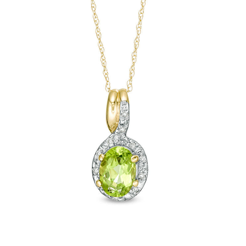 Oval Peridot and 0.05 CT. T.W. Natural Diamond Frame Bypass Pendant in 10K Yellow Gold