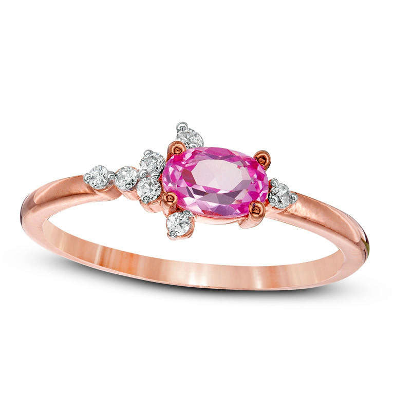 Oval Lab-Created Pink Sapphire and 0.07 CT. T.W. Diamond Side Accent Promise Ring in Solid 10K Rose Gold