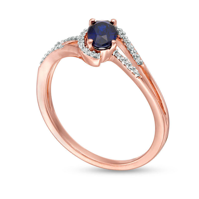 Oval Lab-Created Blue Sapphire and 0.07 CT. T.W. Diamond Swirling Bypass Split Shank Promise Ring in Solid 10K Rose Gold