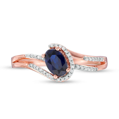 Oval Lab-Created Blue Sapphire and 0.07 CT. T.W. Diamond Swirling Bypass Split Shank Promise Ring in Solid 10K Rose Gold