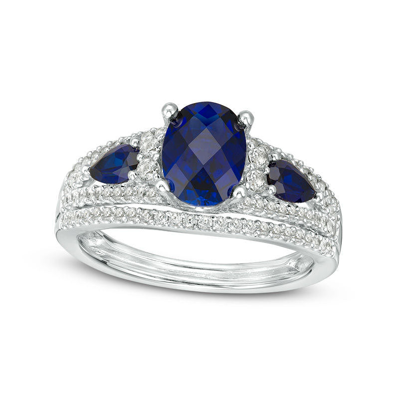 Oval Lab-Created Blue Sapphire and 0.50 CT. T.W. Diamond Three Stone Ring in Solid 10K White Gold