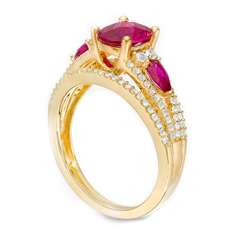 Oval Lab-Created Ruby and 0.50 CT. T.W. Diamond Three Stone Ring in Solid 10K Yellow Gold