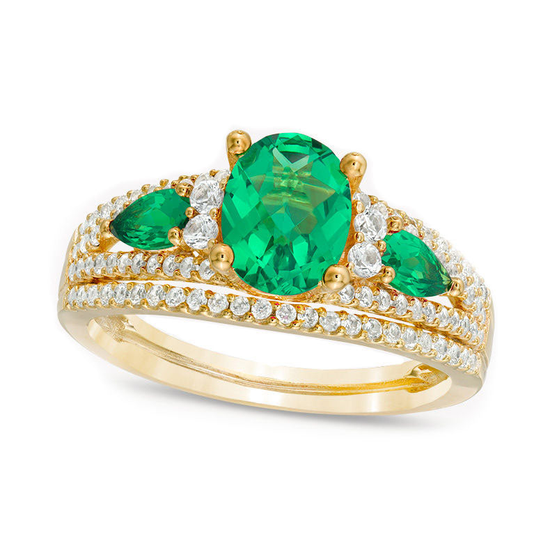 Oval Lab-Created Emerald and 0.50 CT. T.W. Diamond Three Stone Ring in Solid 10K Yellow Gold