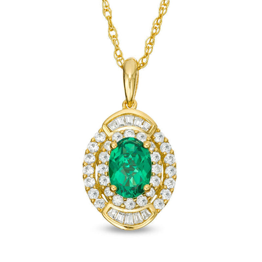 Oval Emerald and 0.33 CT. T.W. Natural Diamond Double Frame Pendant in 10K Yellow Gold