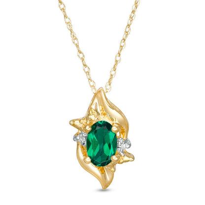 Oval Lab-Created Emerald and Diamond Accent Flame Burst Pendant in 10K Yellow Gold