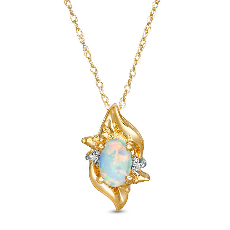 Oval Lab-Created Opal and Diamond Accent Flame Burst Pendant in 10K Yellow Gold