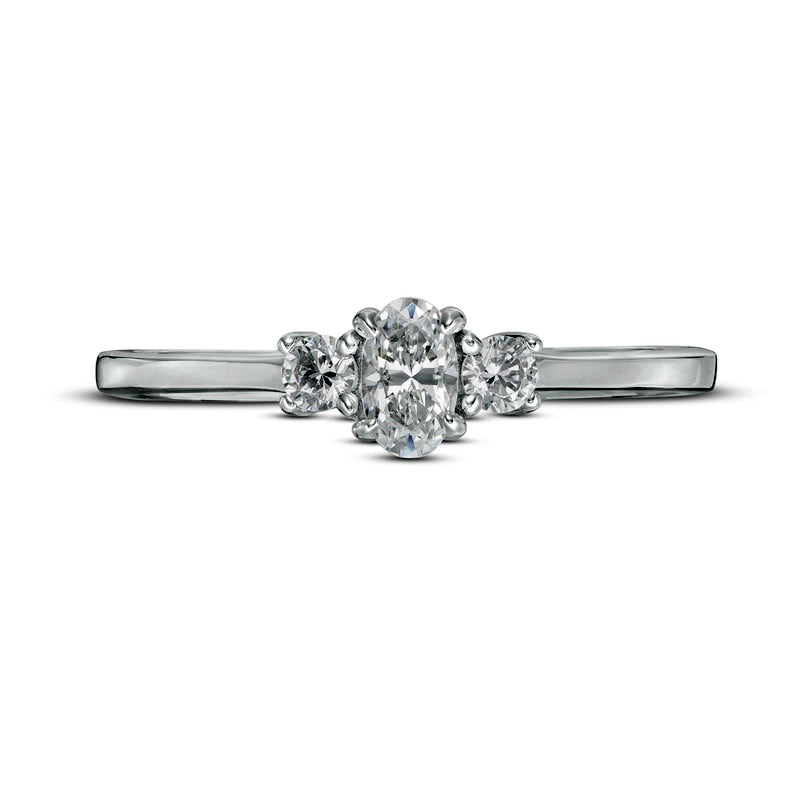 0.50 CT. T.W. Oval and Round Natural Diamond Three Stone Engagement Ring in Solid 14K White Gold