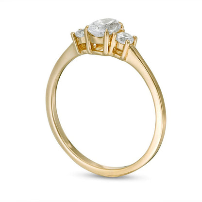 0.63 CT. T.W. Oval and Round Natural Diamond Three Stone Engagement Ring in Solid 14K Gold