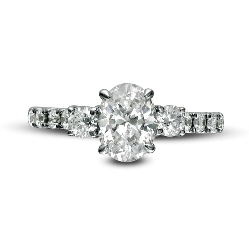 1.75 CT. T.W. Oval and Round Natural Diamond Three Stone Engagement Ring in Solid 14K White Gold