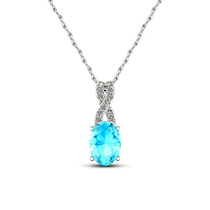Oval Aquamarine and 0.05 CT. T.W. Natural Diamond X" Drop Pendant in 10K White Gold"