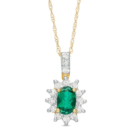 Oval Lab-Created Emerald and 0.2 CT. T.W. Diamond Starburst Frame Pendant in 10K Yellow Gold