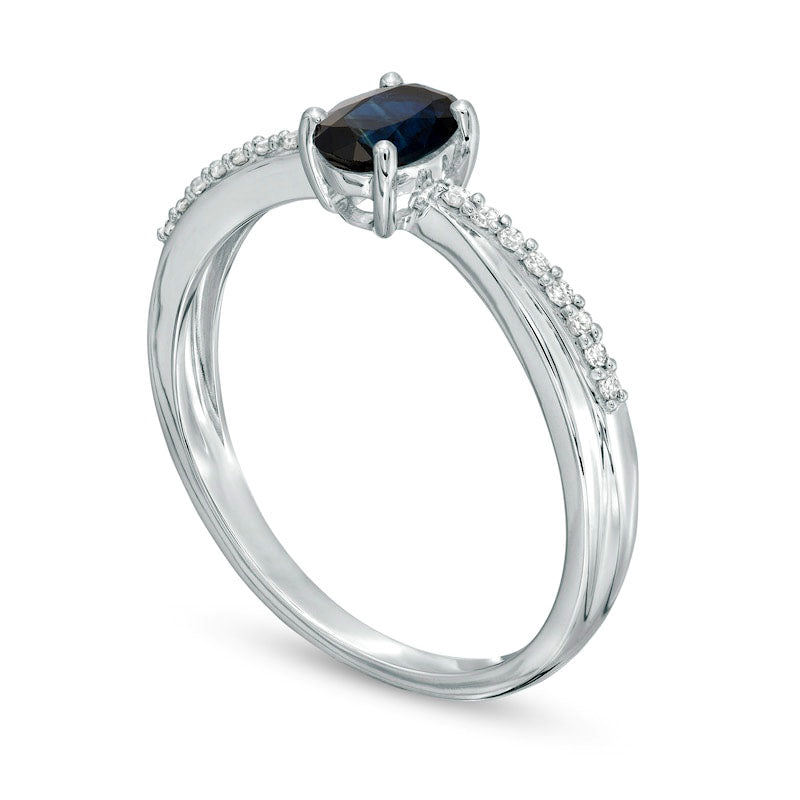 Oval Blue Sapphire and 0.07 CT. T.W. Natural Diamond Criss-Cross Ring in Solid 10K White Gold