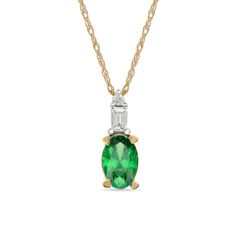 Oval Emerald and 0.05 CT. T.W. Baguette and Round Natural Diamond Stacked Top Accent Pendant in 10K Yellow Gold