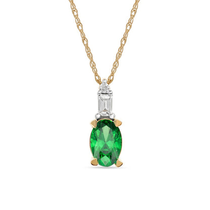 Oval Emerald and 0.05 CT. T.W. Baguette and Round Natural Diamond Stacked Top Accent Pendant in 10K Yellow Gold