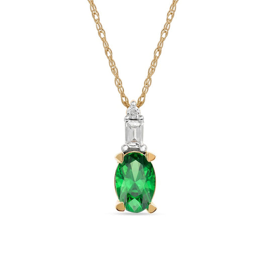 Oval Emerald and 0.05 CT. T.W. Baguette and Round Natural Diamond Stacked Top Accent Pendant in 10K Yellow Gold