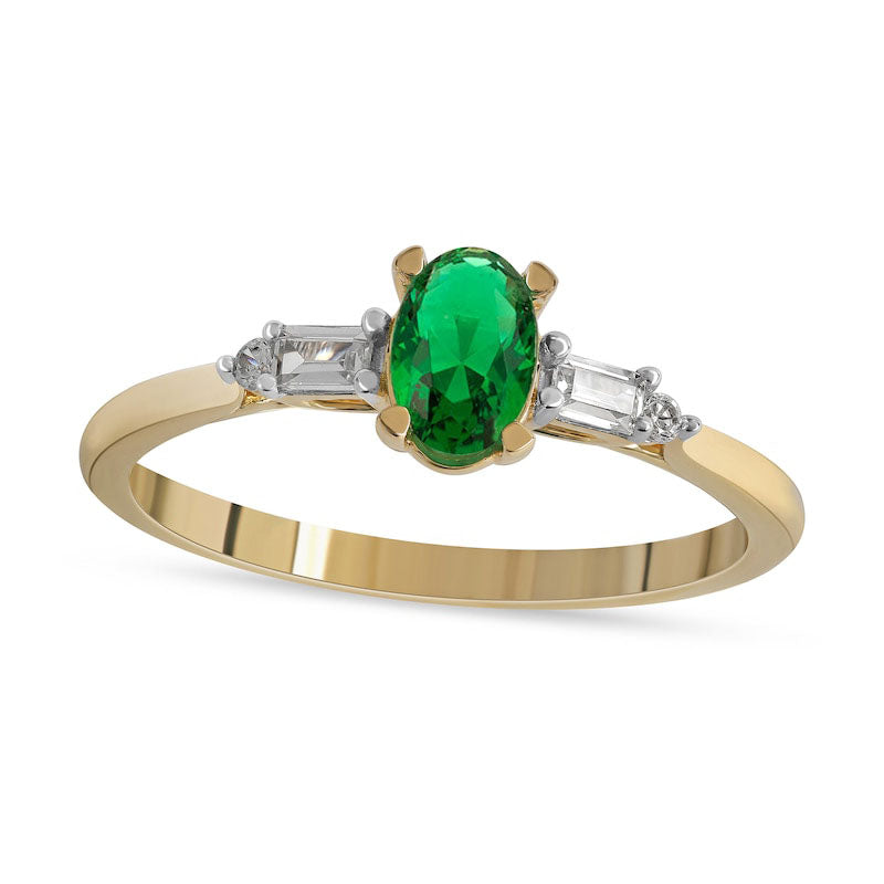 Oval Emerald and 0.10 CT. T.W. Baguette and Round Natural Diamond Side Accent Ring in Solid 10K Yellow Gold