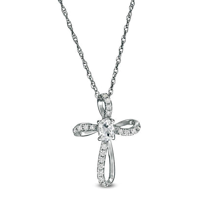 Oval White Topaz and 0.1 CT. T.W. Natural Diamond Pinwheel Cross Pendant in 10K White Gold