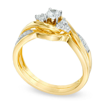 Previously Owned - 0.33 CT. T.W. Natural Diamond Twist Shank Bridal Engagement Ring Set in Solid 10K Yellow Gold