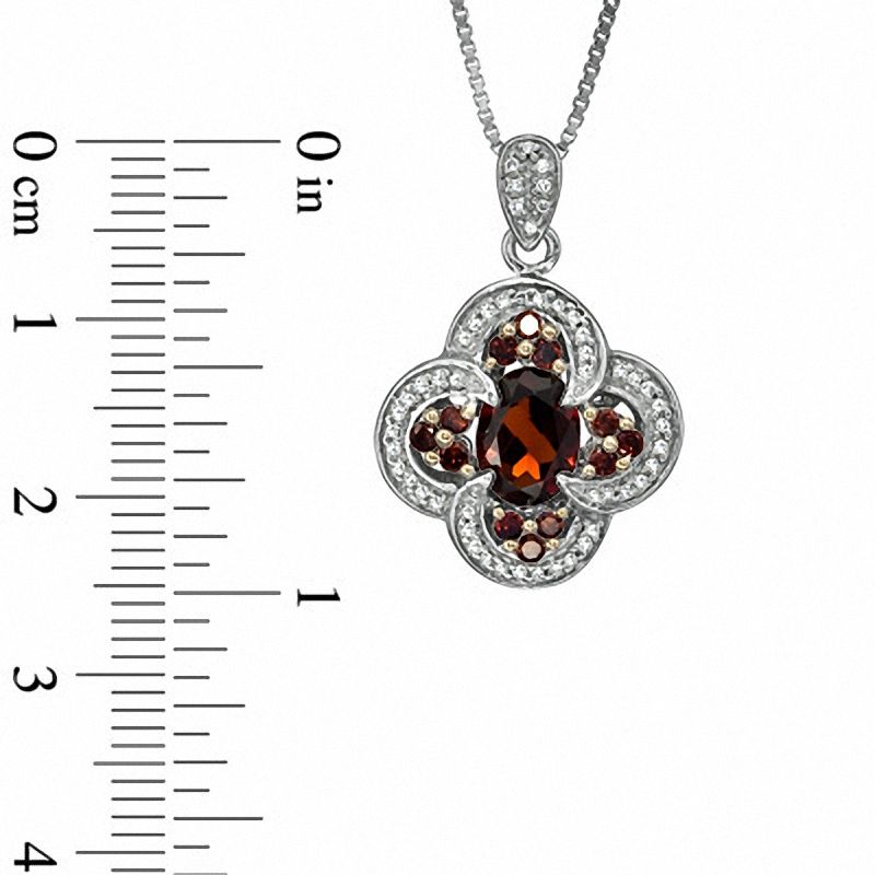 Oval Garnet and 0.33 CT. T.W. Enhanced Red and White Natural Diamond Pendant in Sterling Silver