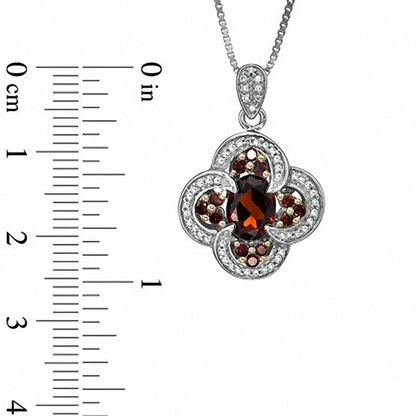Oval Garnet and 0.33 CT. T.W. Enhanced Red and White Natural Diamond Pendant in Sterling Silver