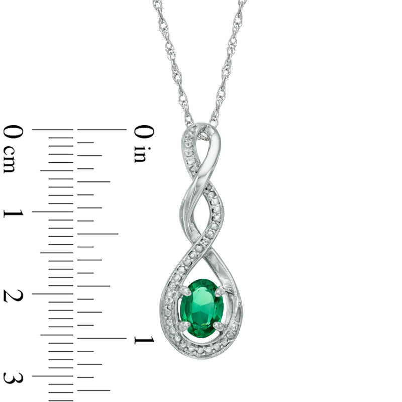 Oval Lab-Created Emerald and Diamond Accent Infinity Twist Pendant in Sterling Silver