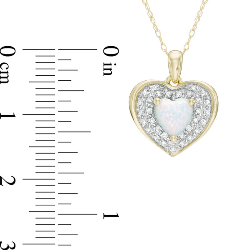 6.0mm Heart-Shaped Lab-Created Opal and 0.13 CT. T.W. Diamond Frame Heart Pendant in 10K Yellow Gold