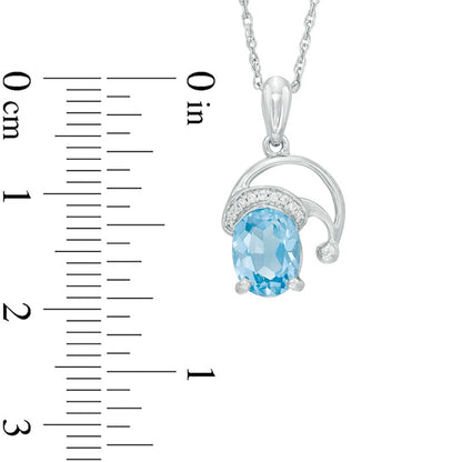 Oval Blue Topaz and Natural Diamond Accent Santa Hat Pendant in Sterling Silver