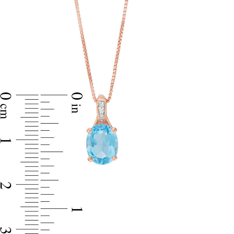 Oval Blue Topaz and Natural Diamond Accent Pendant in Sterling Silver with Rose Rhodium
