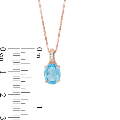 Oval Blue Topaz and Natural Diamond Accent Pendant in Sterling Silver with Rose Rhodium