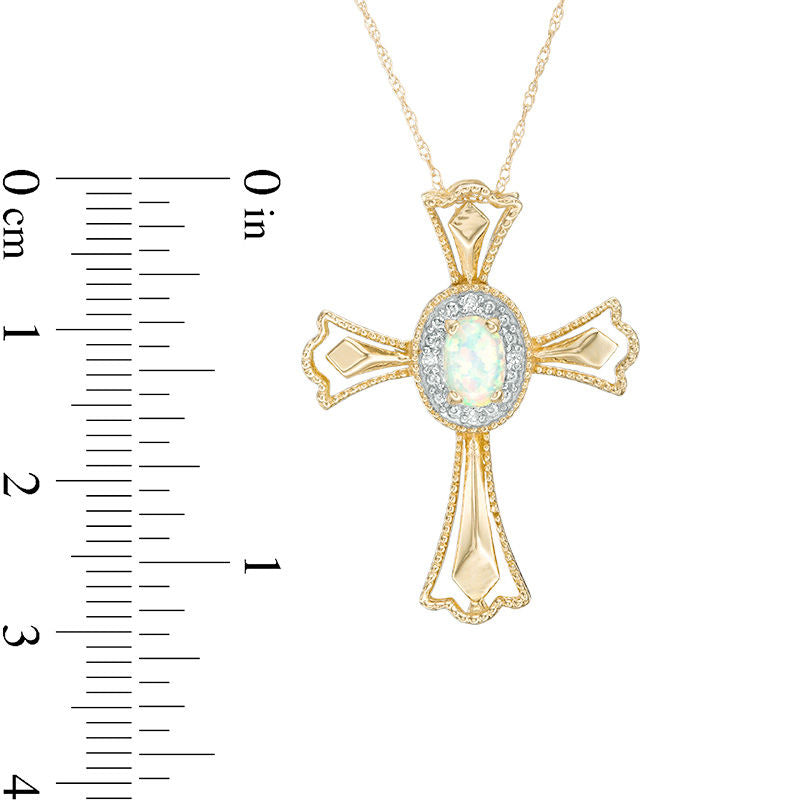 Oval Lab-Created Opal and Diamond Accent Gothic-Style Cross Pendant in 10K Yellow Gold
