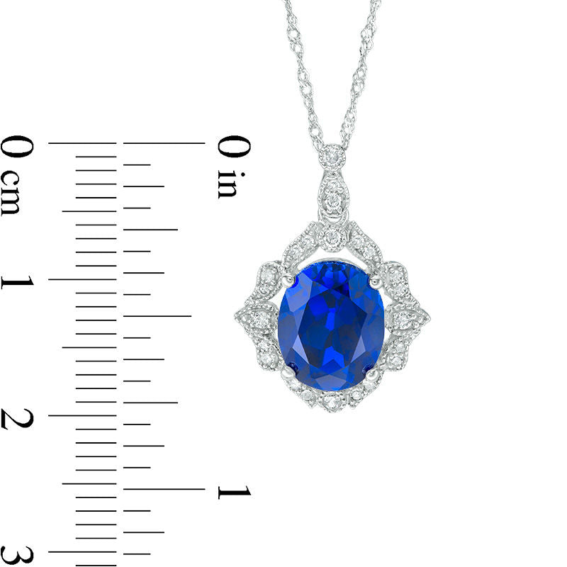 Oval Lab-Created Blue Sapphire and 0.17 CT. T.W. Diamond Antique Vintage-Style Vine Frame Pendant in 10K White Gold