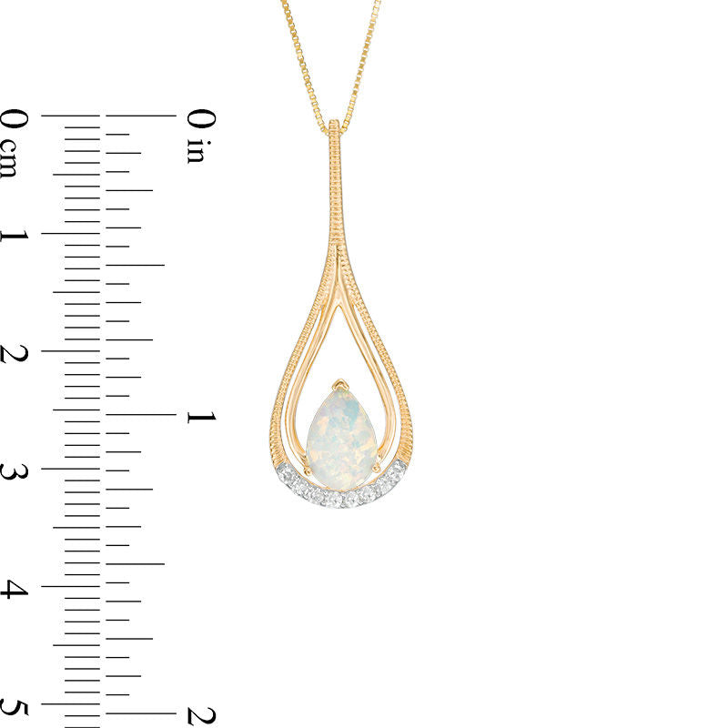 Pear-Shaped Lab-Created Opal and 0.07 CT. T.W. Diamond Double Frame Teardrop Pendant in 10K Yellow Gold