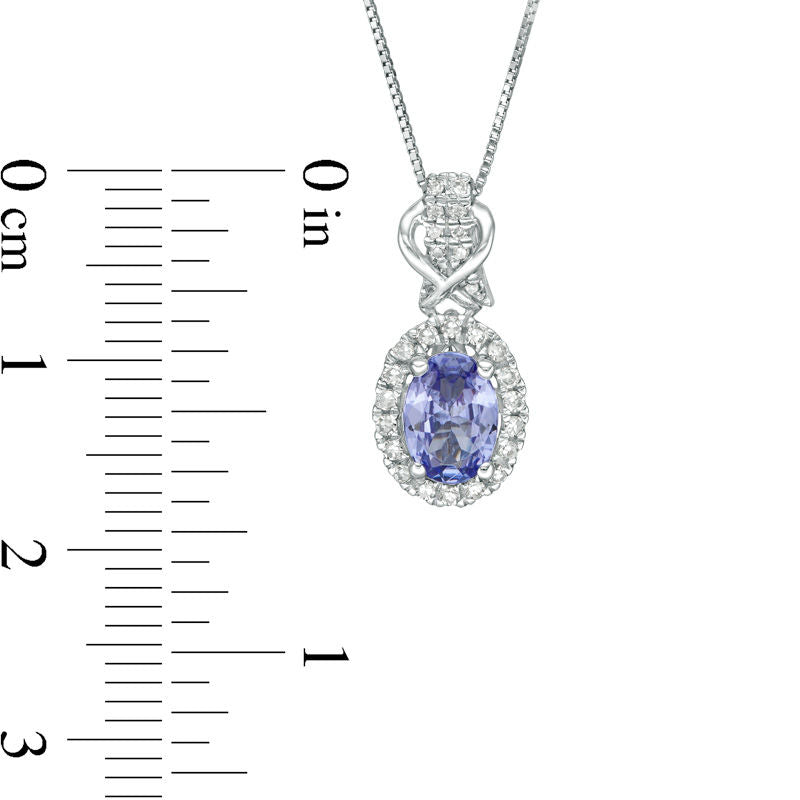 Oval Tanzanite and 0.17 CT. T.W. Natural Diamond Frame Overlay Pendant in 10K White Gold
