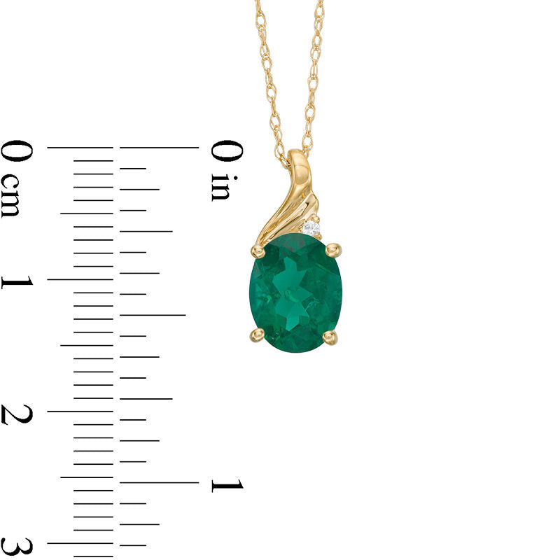 Oval Lab-Created Emerald and Diamond Accent Swirl Top Pendant in 10K Yellow Gold