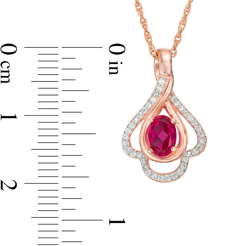 Oval Lab-Created Ruby and 0.17 CT. T.W. Diamond Teardrop Frame Leaf Pendant in 10K White, Yellow or Rose Gold