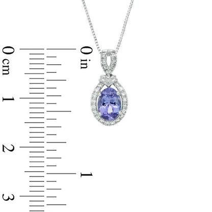 Oval Tanzanite and 0.13 CT. T.W. Natural Diamond Frame with Double Chevron Accent Drop Pendant in 10K White Gold