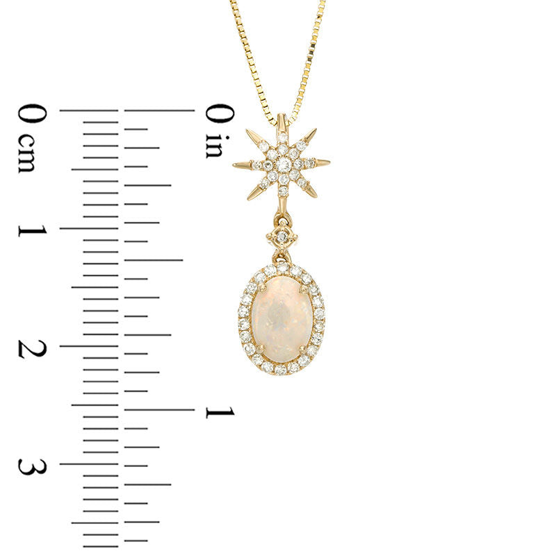 Oval Opal and 0.17 CT. T.W. Natural Diamond Frame Starburst Drop Pendant in 10K Yellow Gold