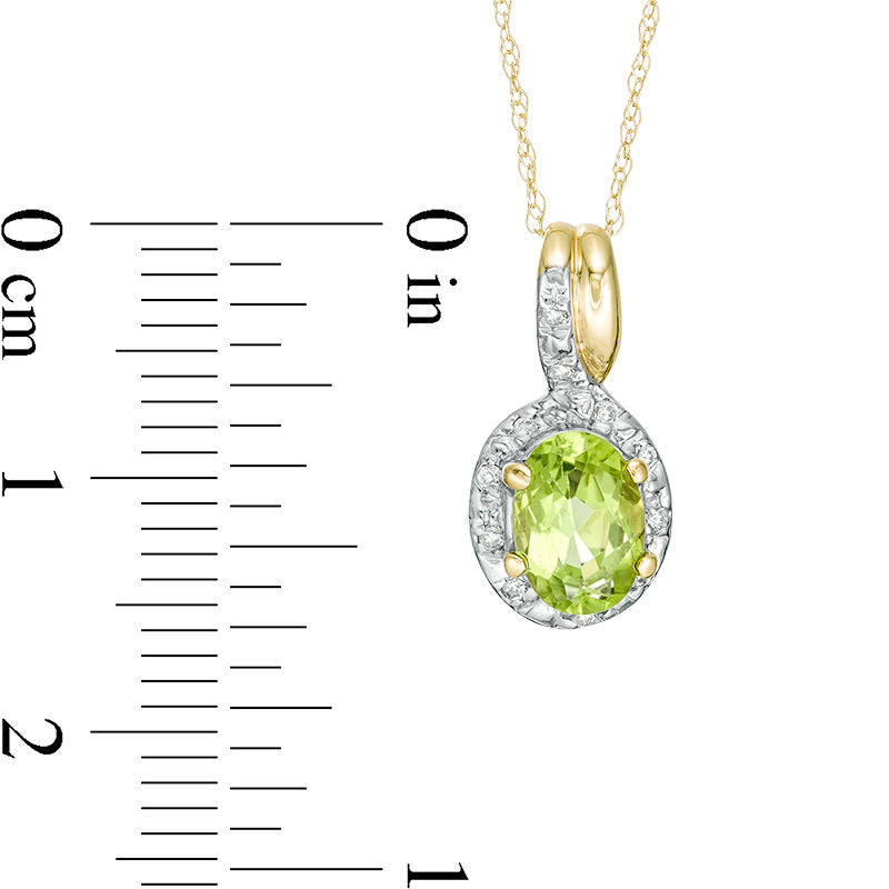 Oval Peridot and 0.05 CT. T.W. Natural Diamond Frame Bypass Pendant in 10K Yellow Gold