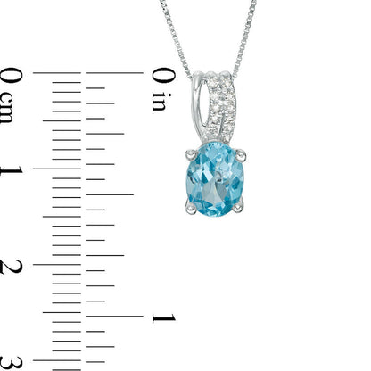 Oval Blue Topaz and Natural Diamond Accent Drop Pendant in 10K White Gold