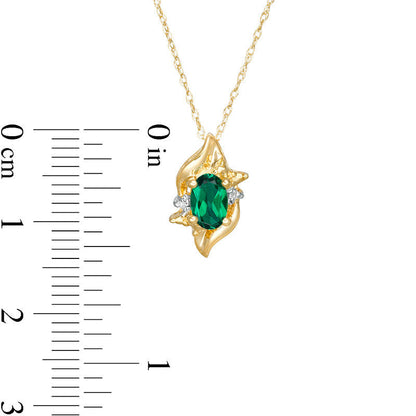 Oval Lab-Created Emerald and Diamond Accent Flame Burst Pendant in 10K Yellow Gold