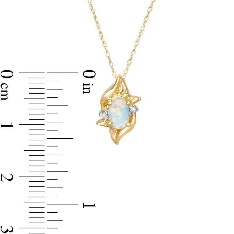 Oval Lab-Created Opal and Diamond Accent Flame Burst Pendant in 10K Yellow Gold