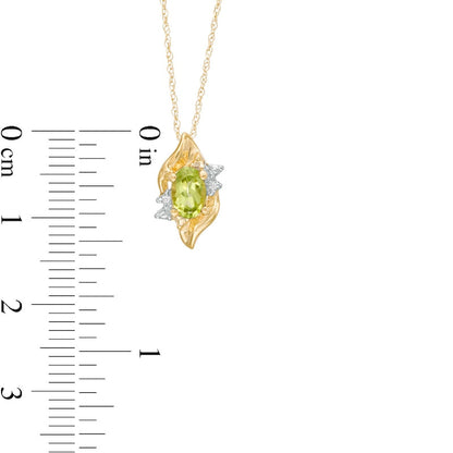 Oval Peridot and Natural Diamond Accent Flame Burst Pendant in 10K Yellow Gold