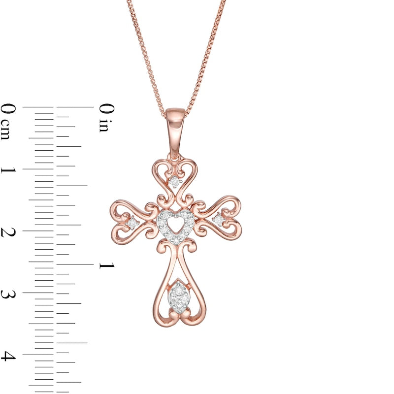 0.13 CT. T.W. Natural Diamond Heart-Shaped Cross Pendant in Sterling Silver with 14K Rose Gold Plate